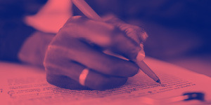 Hand writing on paper with pen